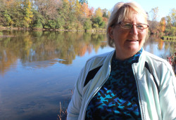 Sue Boley on her deck overlooking the river.