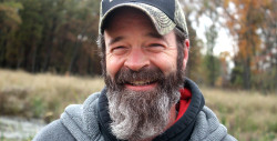 Outdoorsman and environmentalist Craig Ritter pulls tar balls from the Kalamazoo River. Video