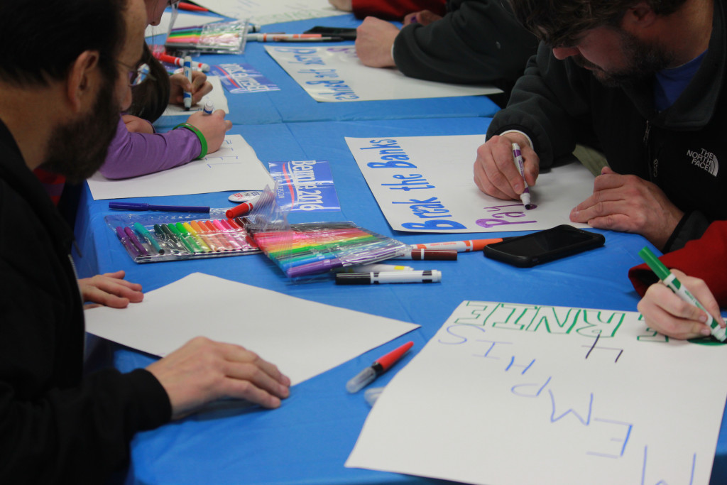 The poster painting station stayed busy for my entire two-hour stay. The crowd included boys, girls, men and women in roughly equal numbers. The gender split seemed about even. There seemed to be a few more white people than Black.  The number of older (than me) people was noticeable as was the number of twenty-somethings.   ©Scott Sines 